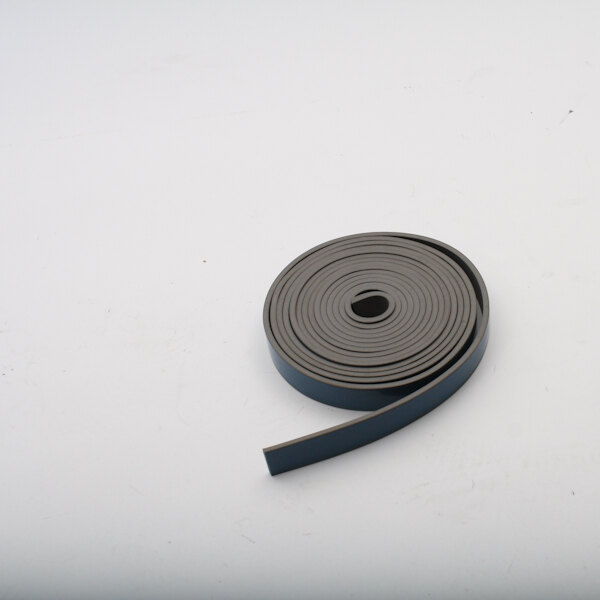 A roll of gray rubber tape on a white surface.