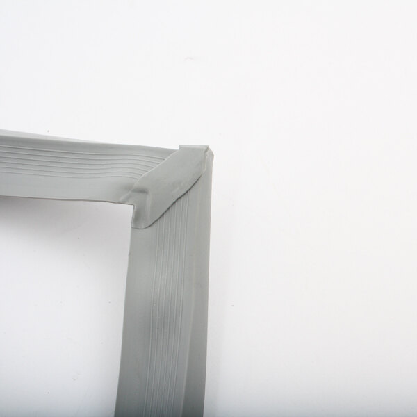 A close up of a white plastic corner on a gray Cres Cor gasket.