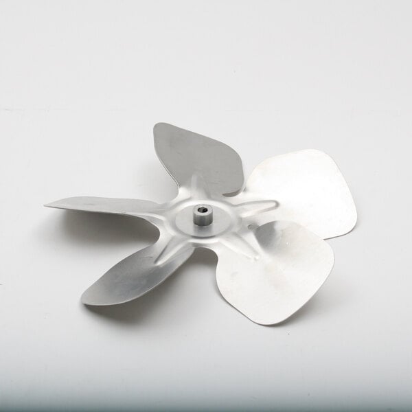 A metal fan blade on a white surface.
