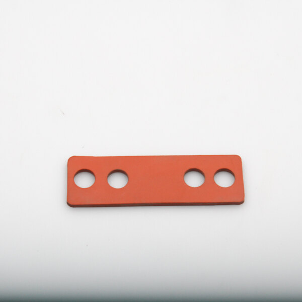 A red rectangular Southern Pride gasket with holes.