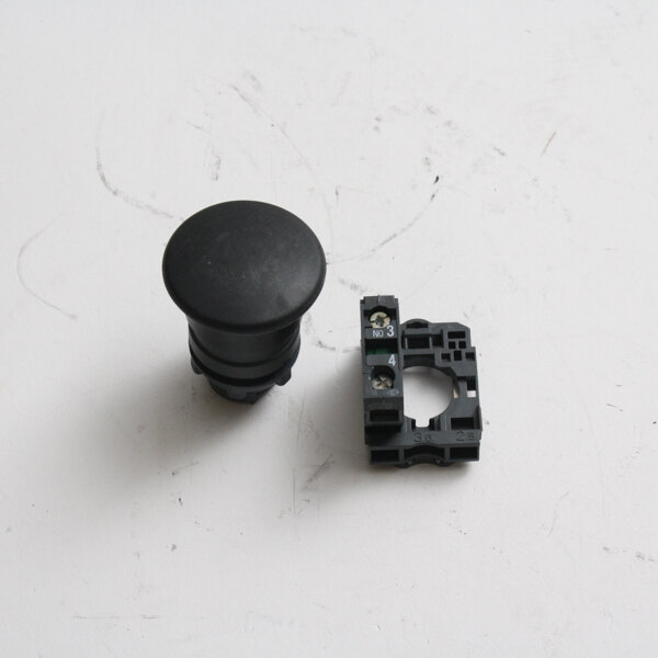 A black round plastic on button with a black cap.