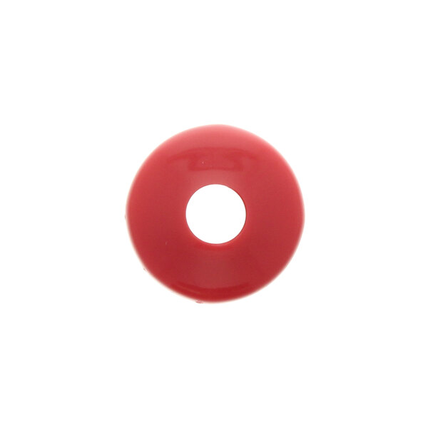 A red plastic cap with a hole in the middle.