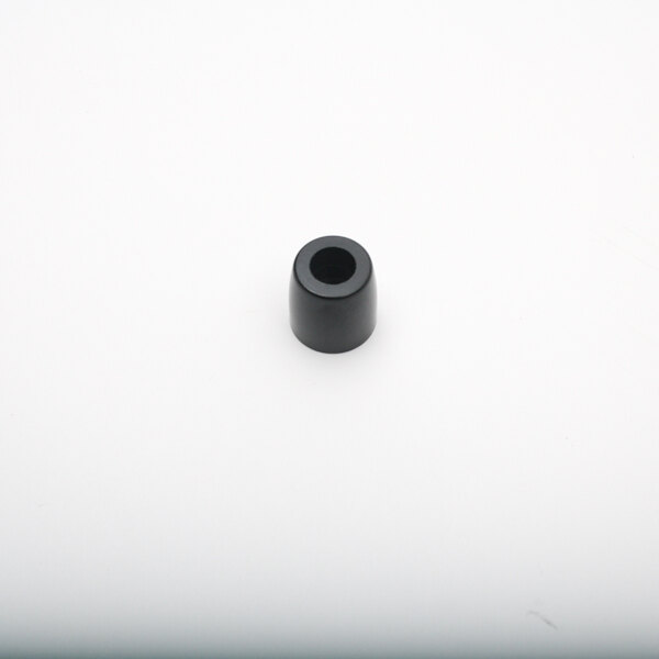 A black plastic cylindrical foot with a hole in it.