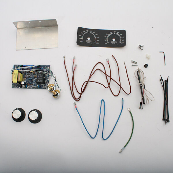 A group of electrical components including a clock.