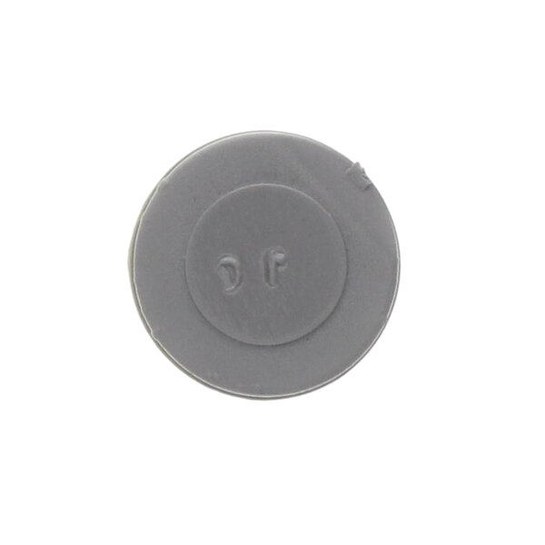 A gray plastic circle with the number 102709 on it.