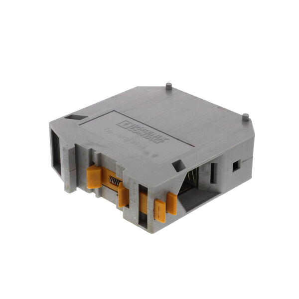 A grey rectangular Champion terminal block with yellow and orange wires connected to it.