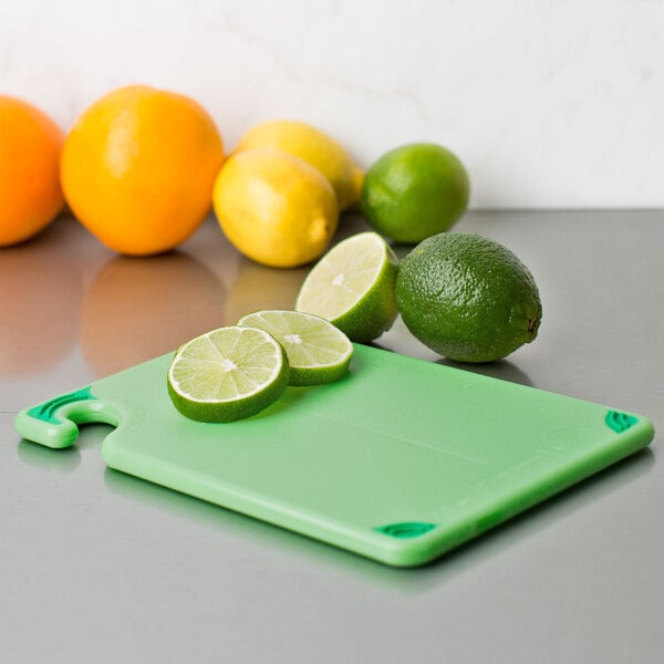 San Jamar CBG6938GN Saf-T-Grip® 9" x 6" x 3/8" Green Bar Size Cutting Board with Hook