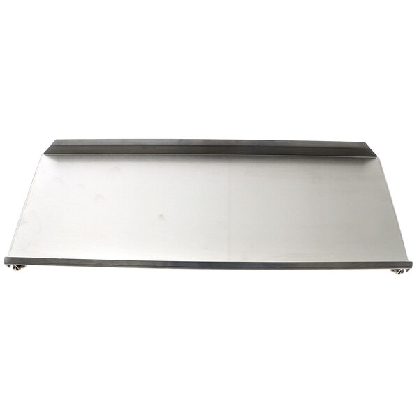 A metal plate for a Silver King front cover on a metal surface.