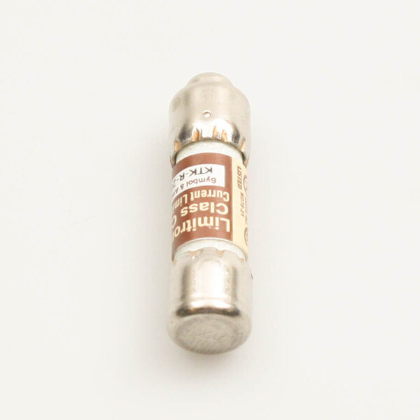 A close-up of a brown and silver Champion 20 amp fuse with a label.