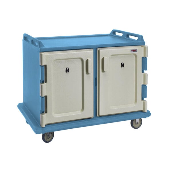 A white and blue Cambro meal delivery cart with two doors.