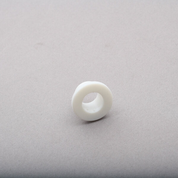 A white plastic ring with a grey center.