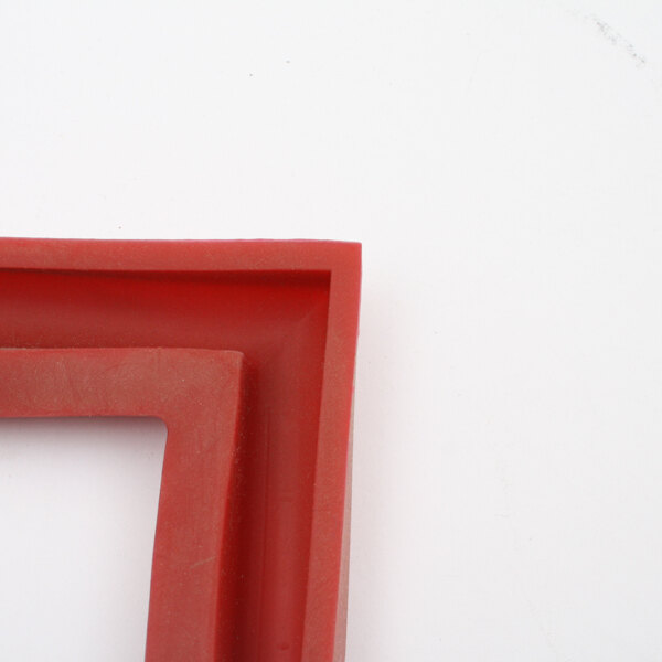 A close-up of a red corner on a white background.