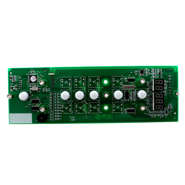 A green electronic board with white round buttons.