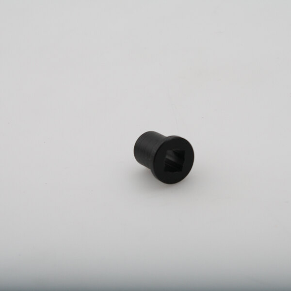 A black Cleveland bushing with a hexagon shape on a white surface.