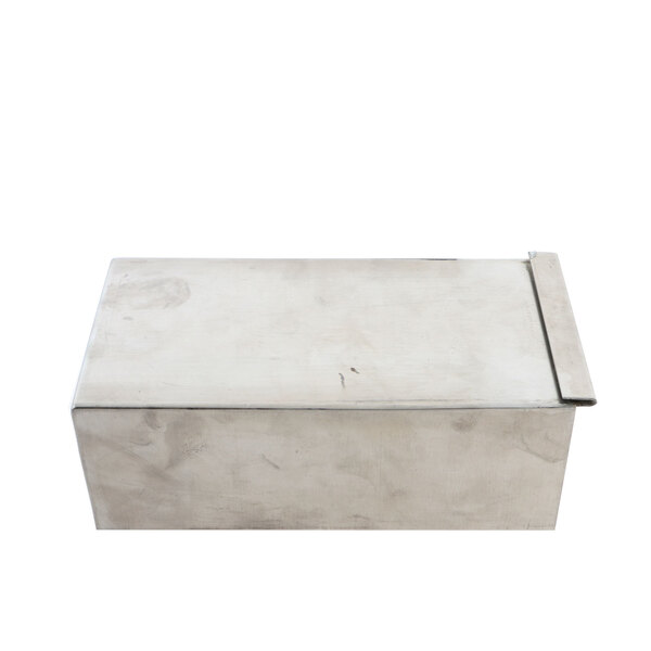 A metal box with a lid on a metal surface.
