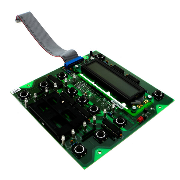 A green Franke circuit board with a black screen and a gray ribbon.