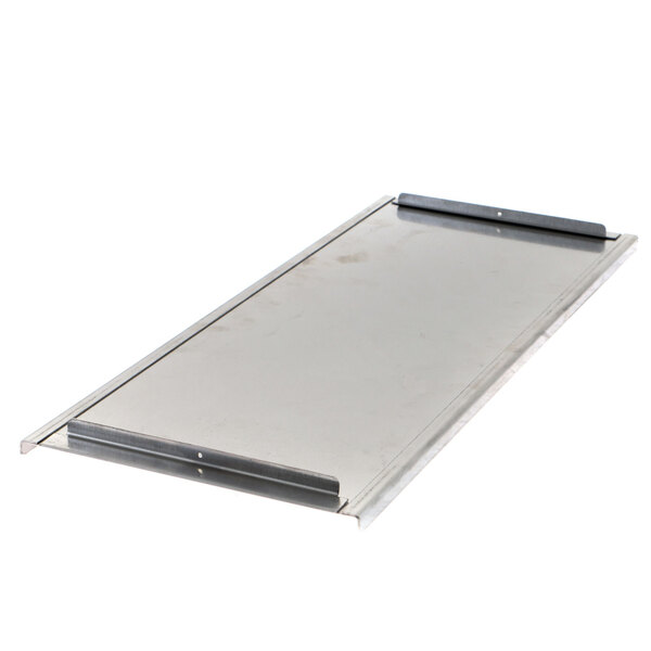 A metal plate with a handle on it.