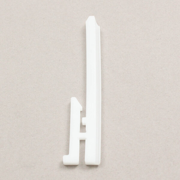 A white plastic Robot Coupe retaining pin.