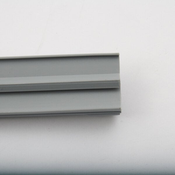 A close-up of a grey plastic strip.