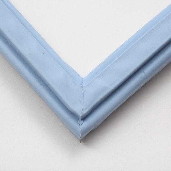 A blue plastic Delfield gasket corner on a white surface.
