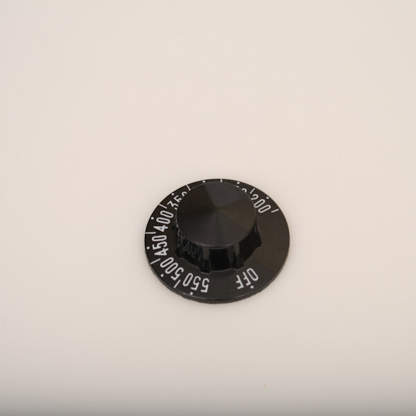 A black Pitco Tstat knob with numbers on it.