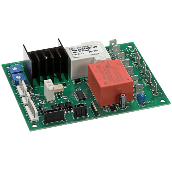 A green circuit board with white and red electronic components, including a computer chip, and a red and white electronic device.