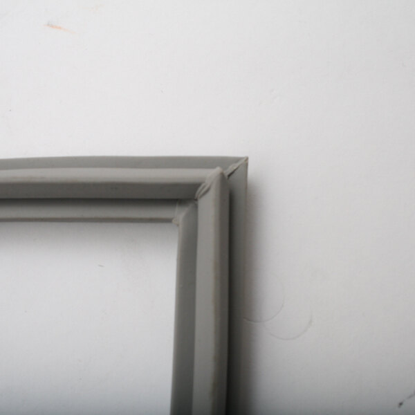 A close up of a grey frame with a white background for a NU-VU Proofer Gasket.