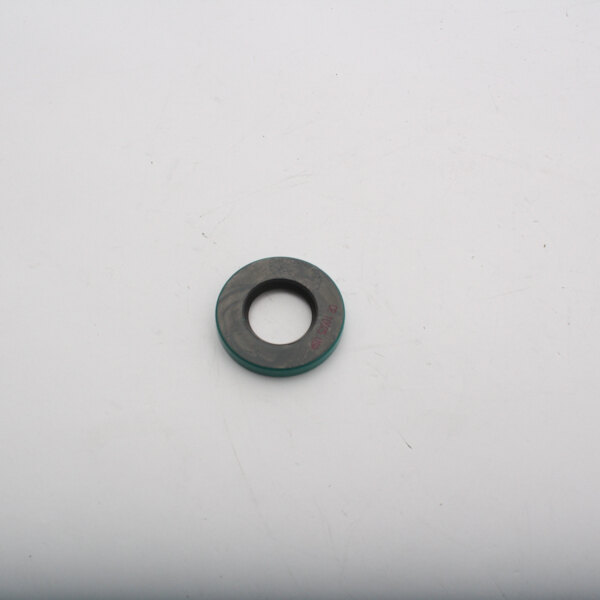 A round black and green Blakeslee oil seal with a white circle.