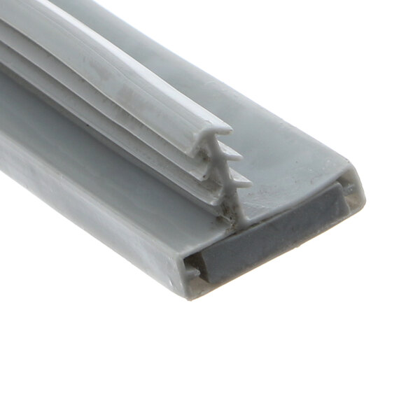 A close-up of a white plastic strip with a plastic frame.