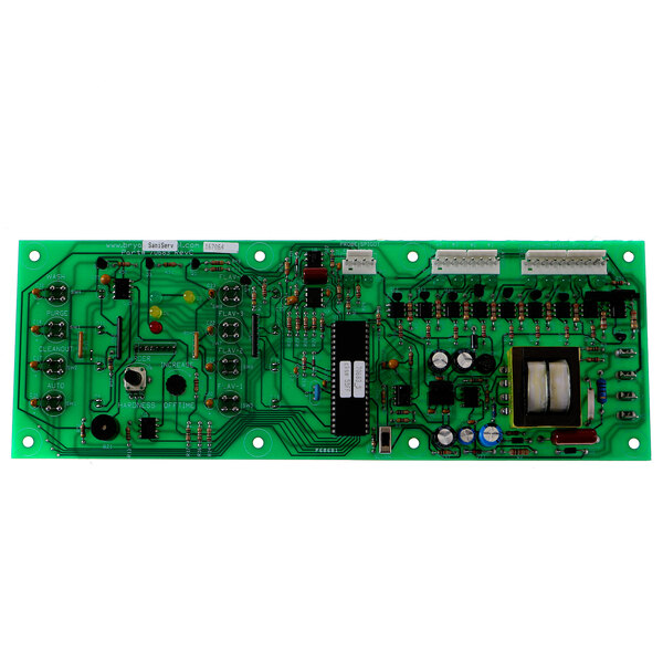 A green SaniServ circuit board with many small components.