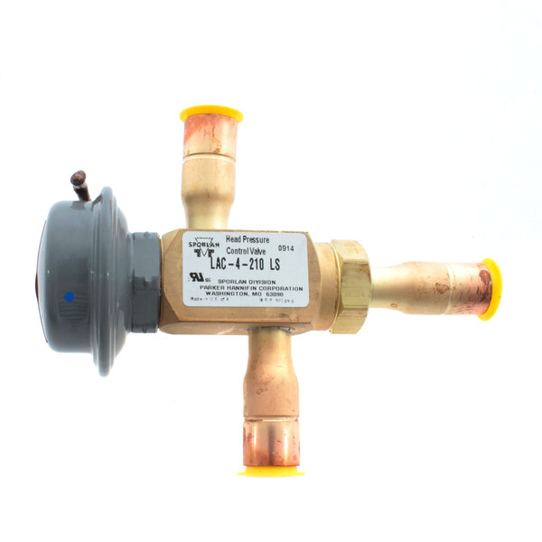 A close-up of a Norlake Pressure Control valve with yellow and white pipes.