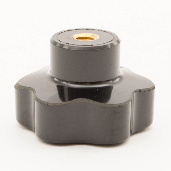 A black plastic Univex knob with a gold center.