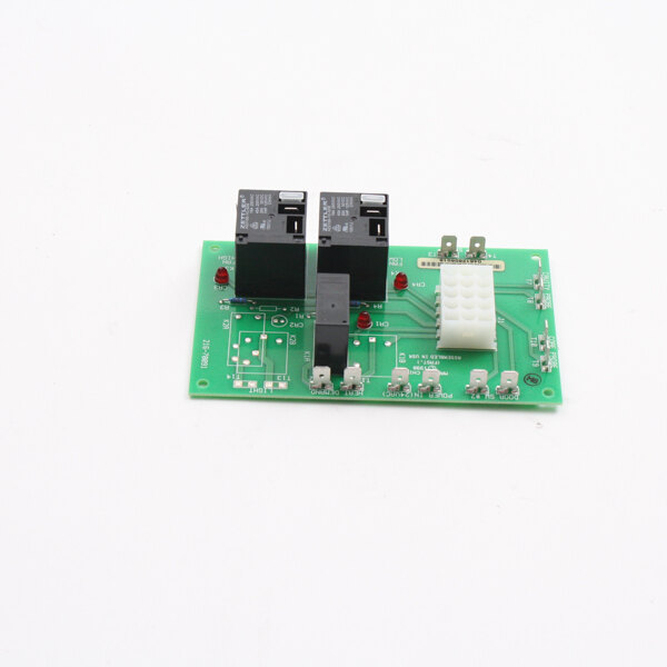 A green circuit board with a black box and two small black and white wires.