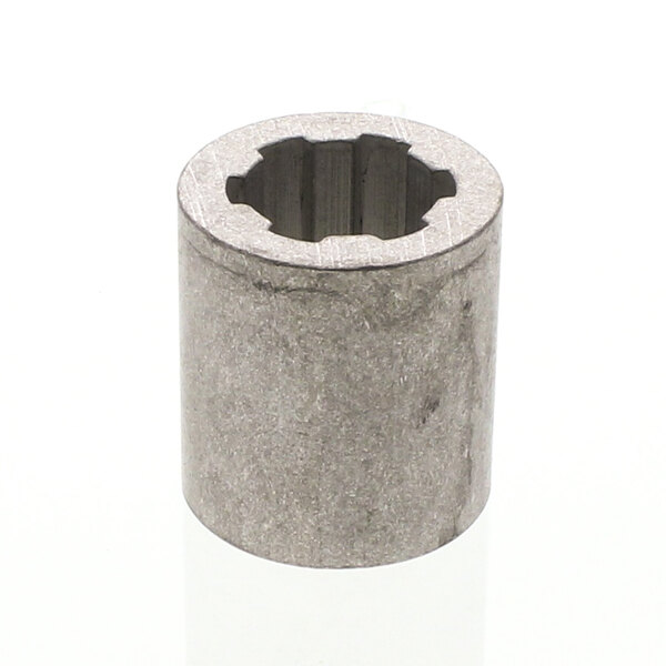A grey metal Scotsman coupling cylinder with a hole in it.