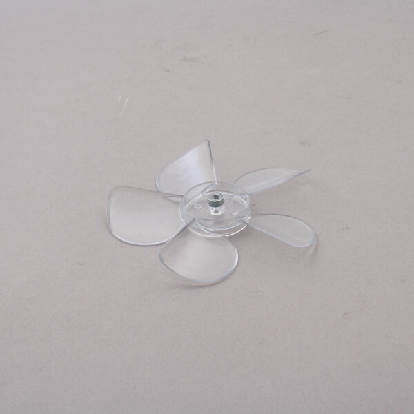 A Master-Bilt plastic fan blade with four blades on a white surface.