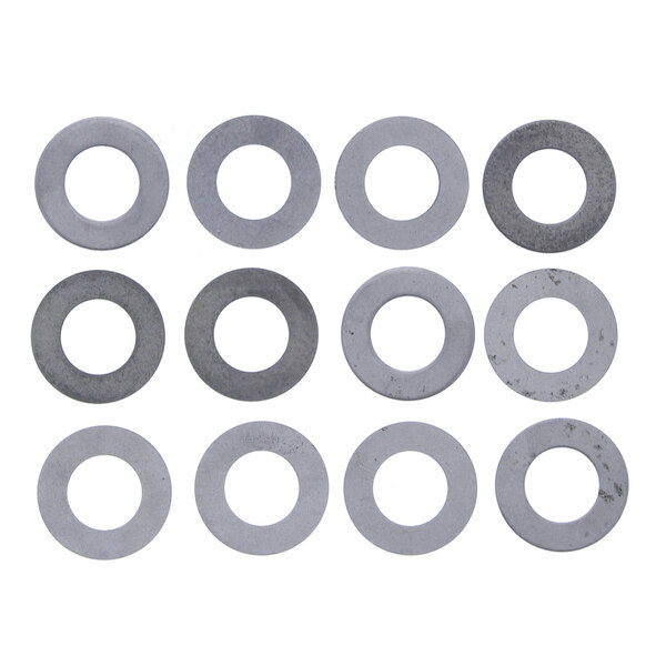 A group of circular metal Globe knife plate shims in a white circle with a grey background.