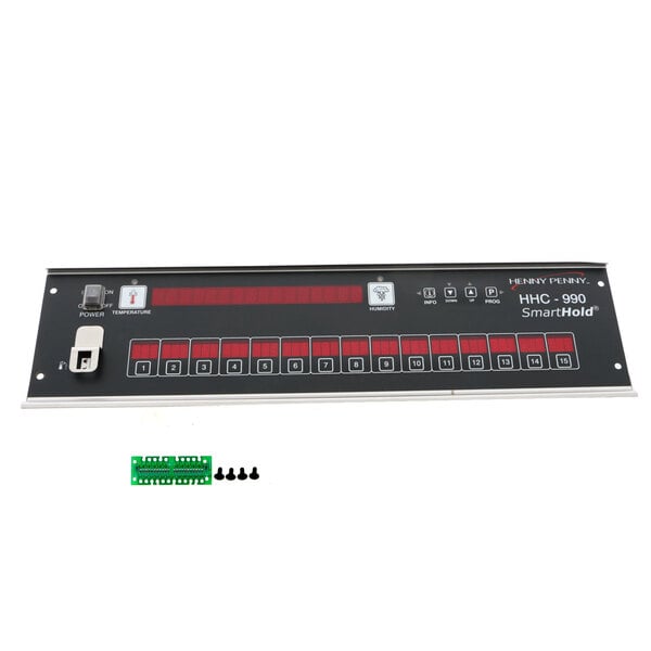 A white Henny Penny control board with a black rectangular device and red and green numbers.