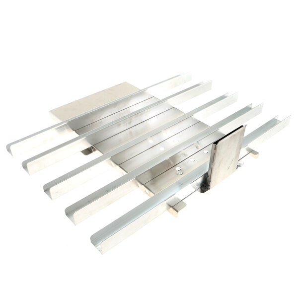 A metal plate with metal bars and a scoop on it.