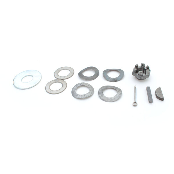 A group of round metal parts including a gear, a washer, and a screw.