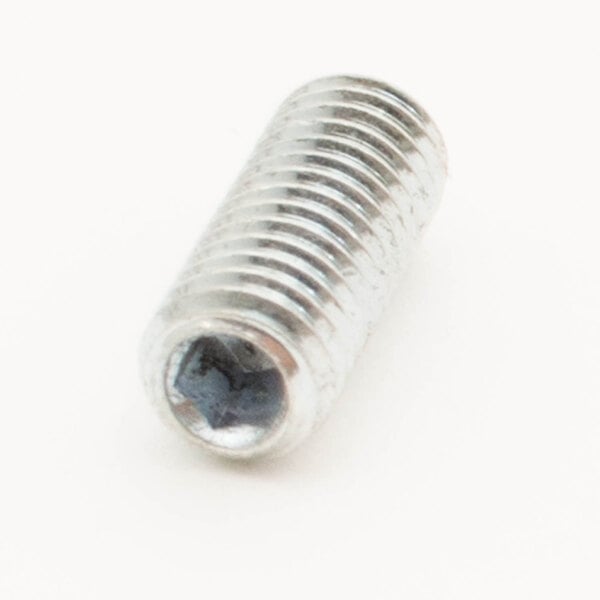 A close-up of a Univex set screw with a small hole.
