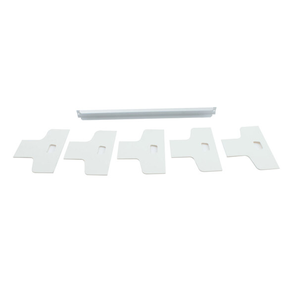 A white rectangular wicking kit with several white plastic clips.