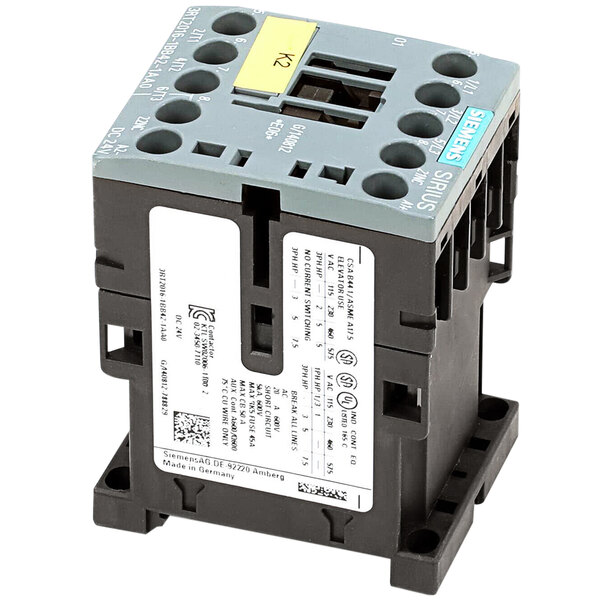 A grey and black Meiko contactor with yellow and black wires.