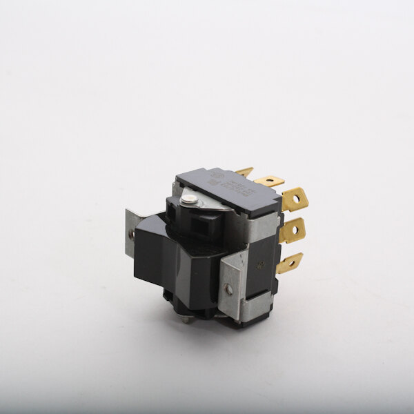 A close up of a black and gold Blakeslee momentary switch.