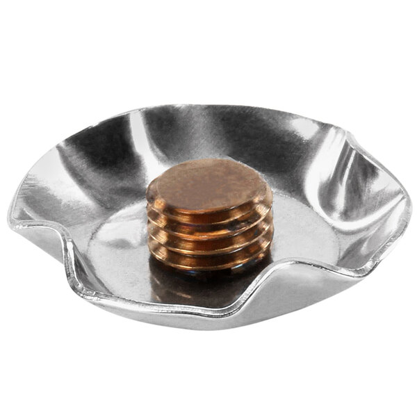 A silver cap end for a dishwasher with a copper coin in it.