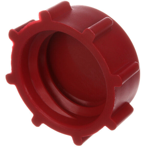 A red plastic Stero manifold clean out cap with holes.