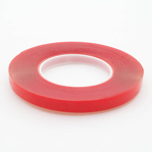 A roll of red Frymaster tape with white edges.