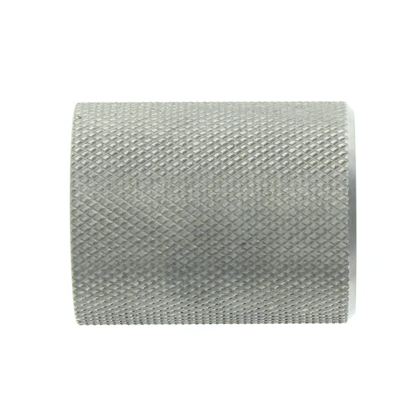 A close-up of a silver metal cylinder with a metal roll inside.