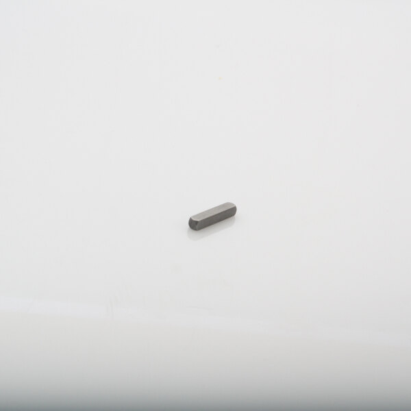 A small metal key way on a white surface.
