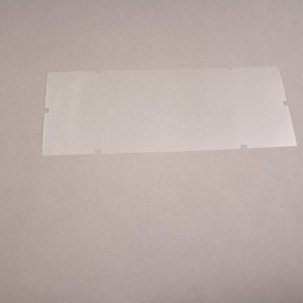 A close-up of a rectangular clear plastic label with a black border.
