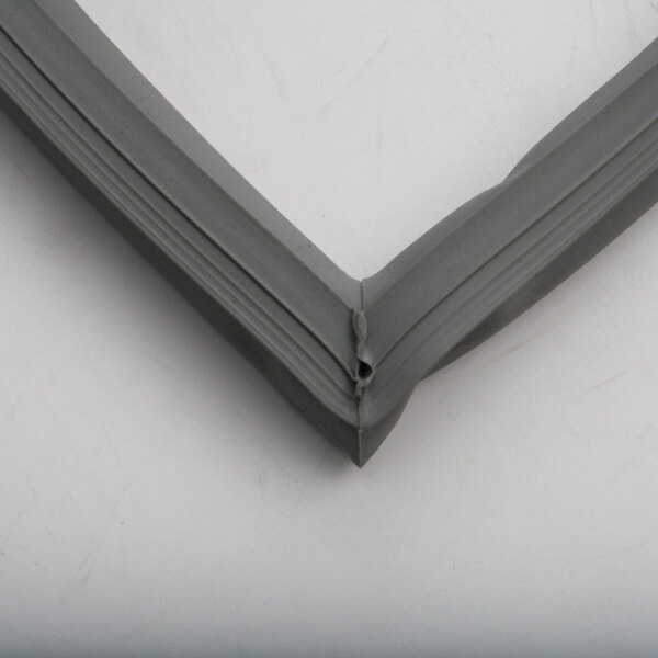 A close up of a grey plastic strip with a corner of a BevLes half door gasket.